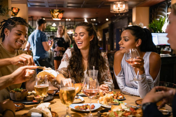 A mixed age range group of friends having a meal together at a top attractions restaurant.