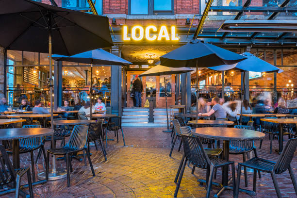 People relax on the patio of a gastropub.