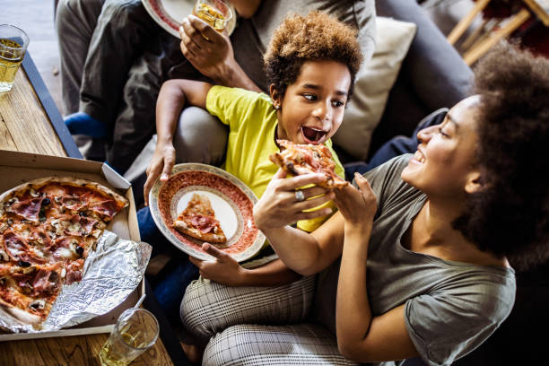 woman feeding child