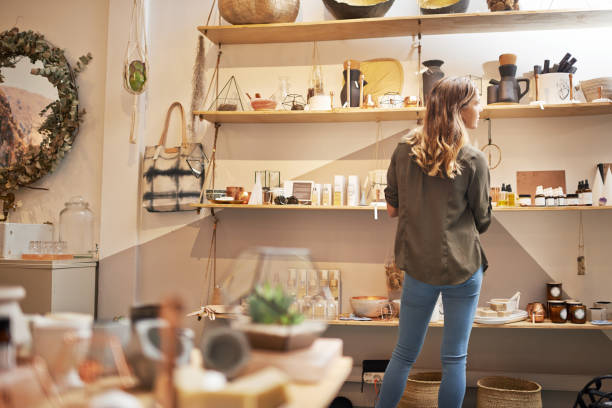 Rearview shot of a young woman looking at products on a shelf