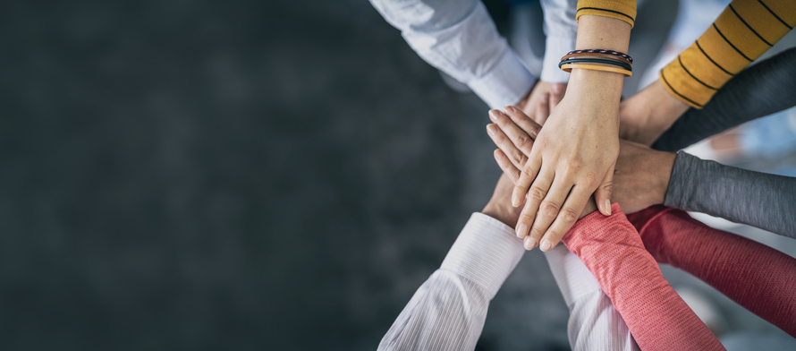 Stack of hands. Unity and teamwork concept.