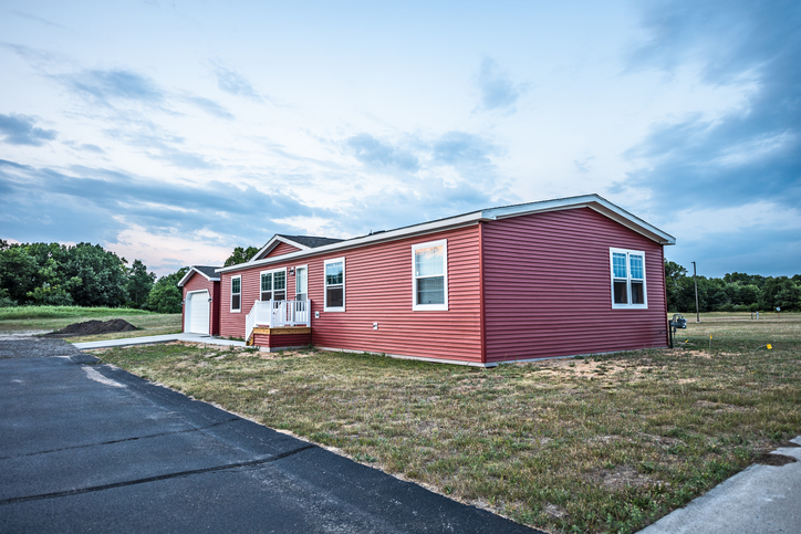 New home in a new community. The window on the far right on the front shows a reflection of the sunset at the top.