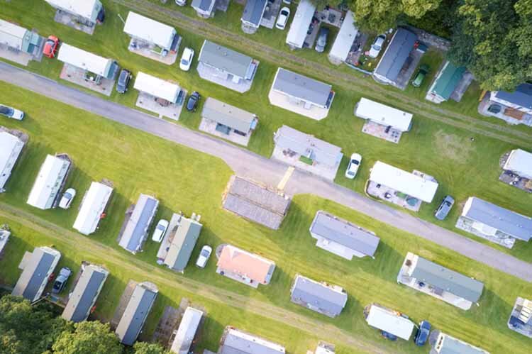 Caravan site park aerial view illuminated by summer sun uk