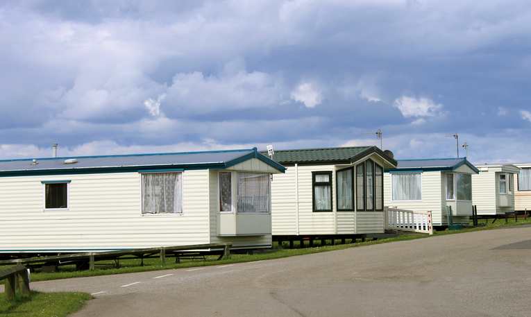 Row of caravan trailers manufactured homes