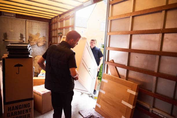 Removal company helping a family move out of their old home pods moving